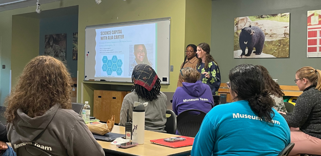 Undergraduate team members lead a presentation on the team’s research methods to Museum of Life and Science staff members. 