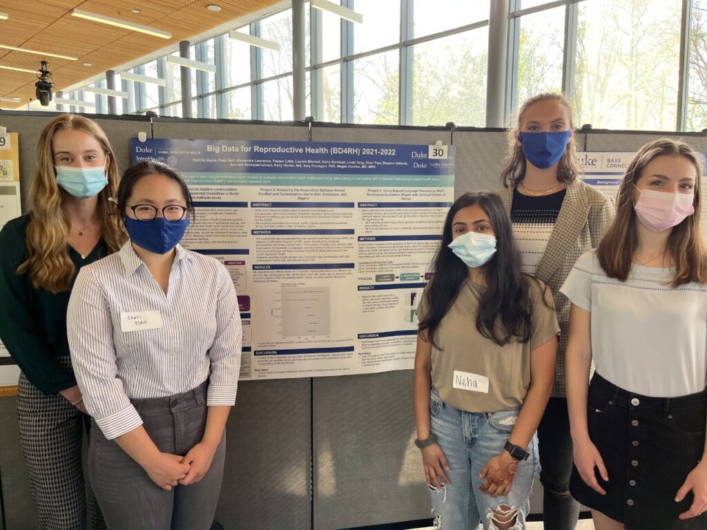 Lawrence (right) and members of the Big Data for Reproductive Health team presenting a poster at the 2022 Fortin Foundation Bass Connections Showcase. (Photo: Courtesy of the project team).