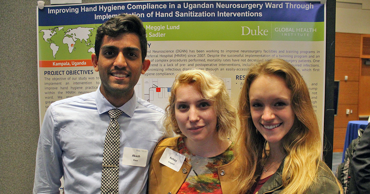 Kelsey Graywill, Sam Sadler and Akash Patel in front of their project poster that won the Bass Connections poster award in 2017