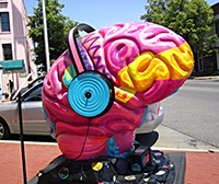 Sculpture of a brain wearing headphones.