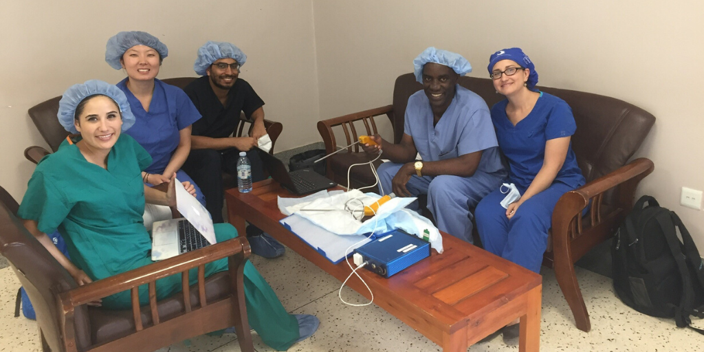Members of the project team presenting the low-cost ReadyView Laparoscope to local surgeons