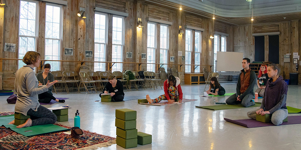 Laura Terry teaching the “Supportive Yoga Environments” workshop.