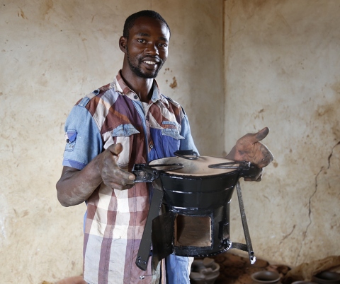 Man holding stove.