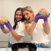 Sophie and Ainsley holding brains.