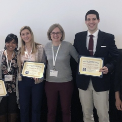 Team members with awards.
