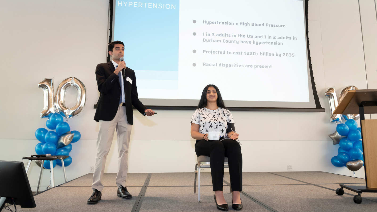 Desai and Anna Tharakan representing the Closing the Gap on Health Disparity and Outcomes in Hypertension team at the 2023 Fortin Foundation Bass Connections Showcase. (Photo: Les Todd).