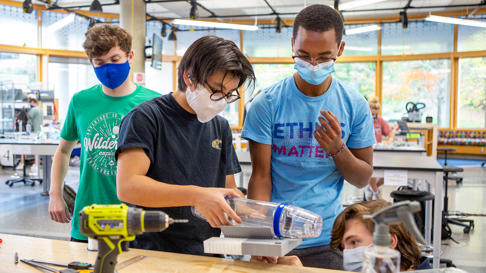 Students working on an engineering project together.