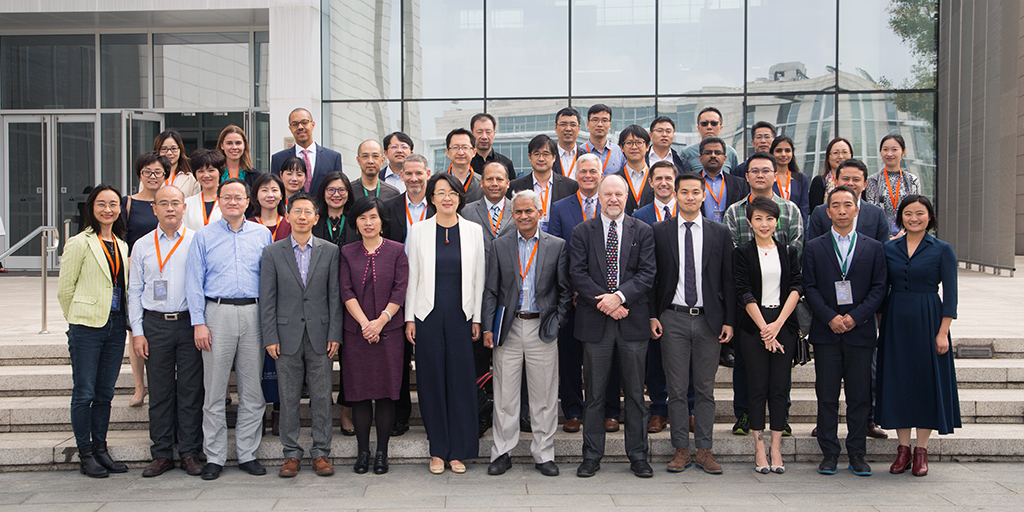 VIP DKU conference with group of people standing on steps