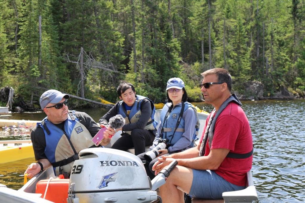 Team leader Jory Weintraub interviews IISD-ELA Head Research Scientist Vince Palace at the site of an experiment investigating the effects of oil spills on lakes.