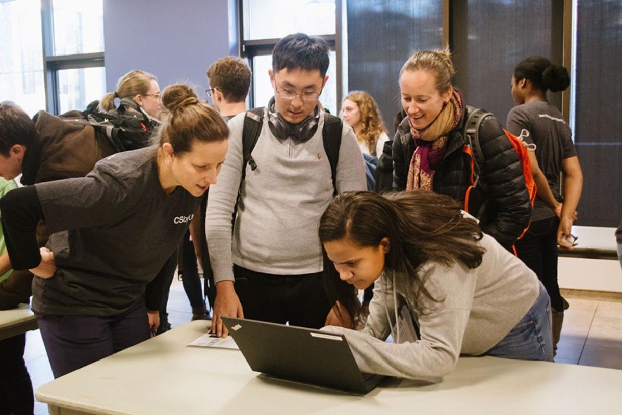 Students looking at a laptop