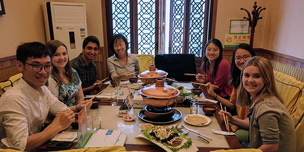 The GANDHI team enjoys a meal together during their trip to China.